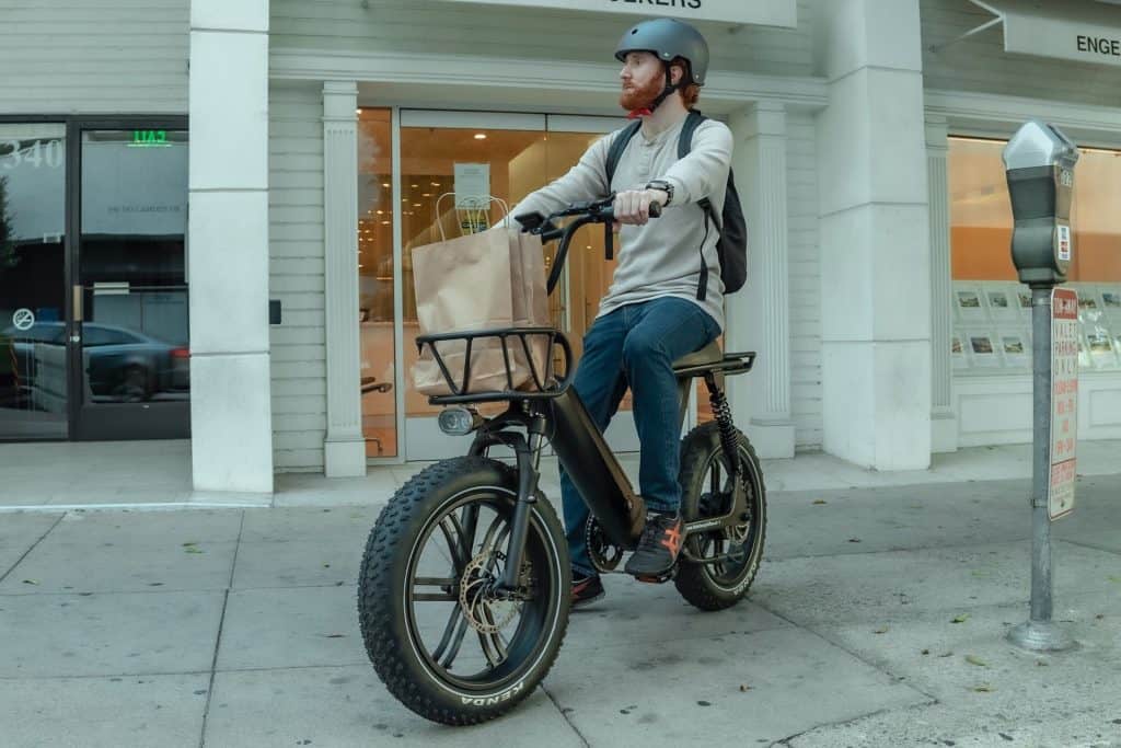 Electric Cargo Bike Guide 3 himiway-ebike-man-riding-around-downtown